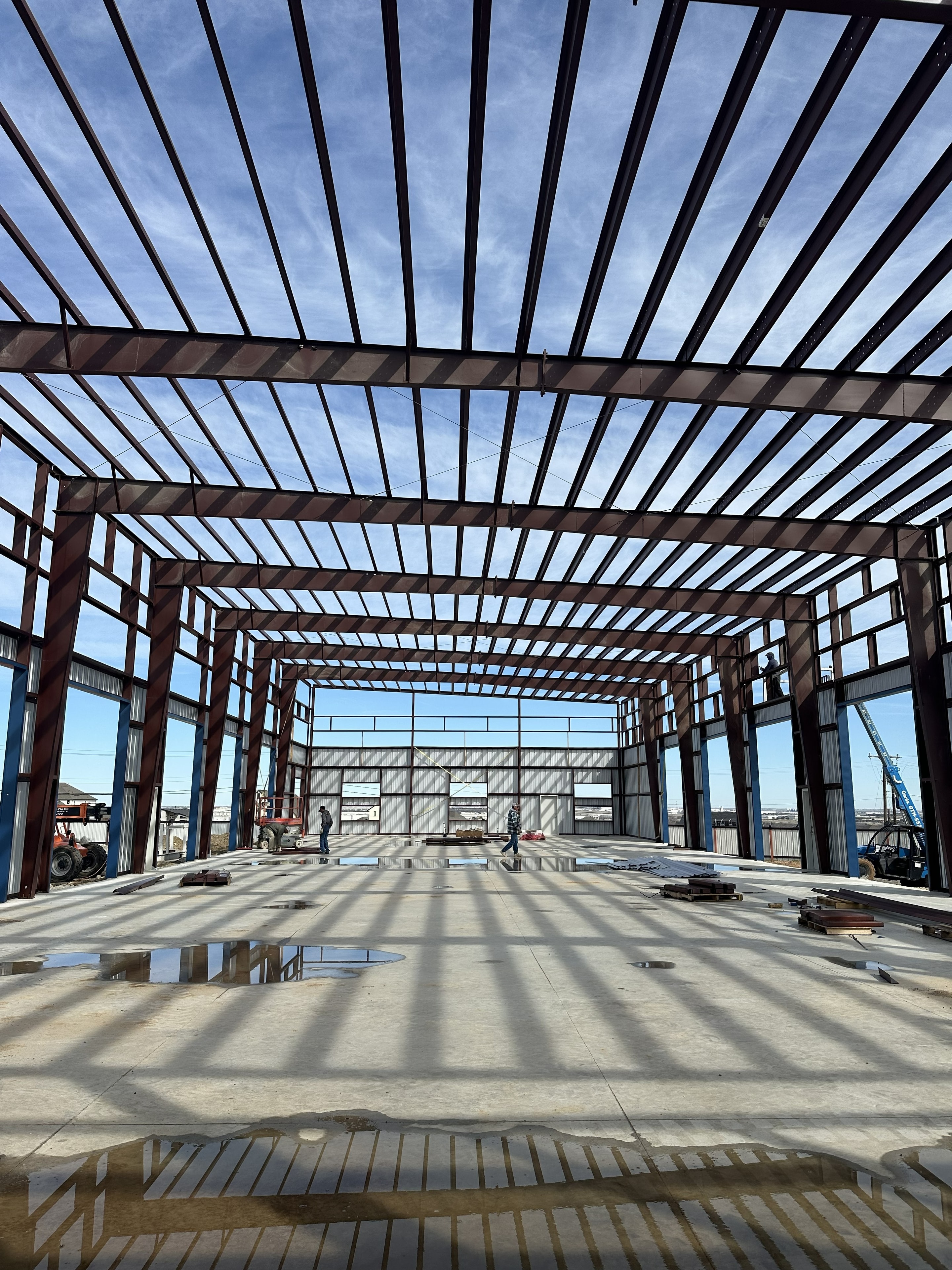 Metal building under construction steel frame erection